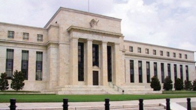 البنك المركزي الامريكي يخفض مشتريات السندات.. ويؤكد على سياسة نقدية تيسيرية
